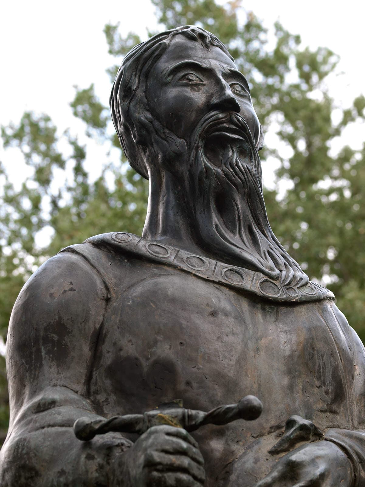 Skanderbeg in armour, holding his sword across his chest.